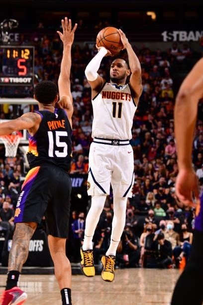 Monte Morris of the Denver Nuggets shoots a three point basket against the Phoenix Suns during Round 2, Game 1 of the 2021 NBA Playoffs on June 7,...