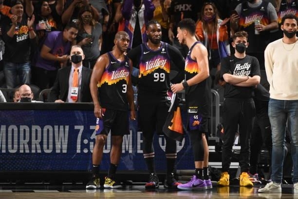 Chris Paul, Jae Crowder and Devin Booker of the Phoenix Suns talk during Round 2, Game 1 of the 2021 NBA Playoffs on June 7, 2021 at Phoenix Suns...