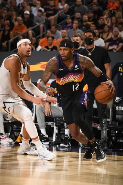 Torrey Craig of the Phoenix Suns dribbles the ball against the Denver Nuggets during Round 2, Game 1 of the 2021 NBA Playoffs on June 7, 2021 at...