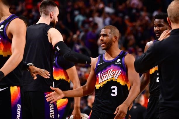 Chris Paul of the Phoenix Suns high fives a teammate against the Denver Nuggets during Round 2, Game 1 of the 2021 NBA Playoffs on June 7, 2021 at...
