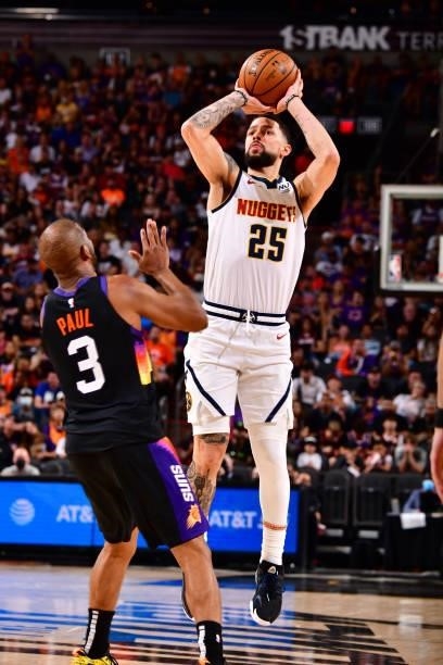 Austin Rivers of the Denver Nuggets shoots a three point basket against the Phoenix Suns during Round 2, Game 1 of the 2021 NBA Playoffs on June 7,...
