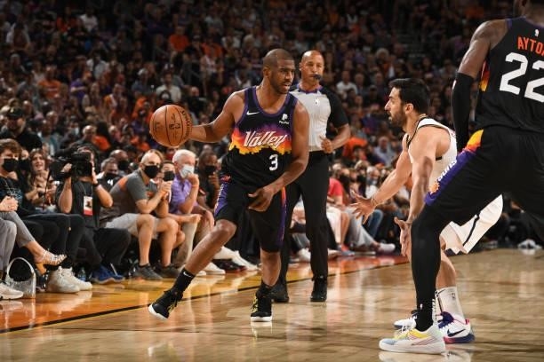 Chris Paul of the Phoenix Suns dribbles the ball during Round 2, Game 1 of the 2021 NBA Playoffs on June 7, 2021 at Phoenix Suns Arena in Phoenix,...