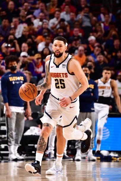 Austin Rivers of the Denver Nuggets dribbles the ball against the Phoenix Suns during Round 2, Game 1 of the 2021 NBA Playoffs on June 7, 2021 at...