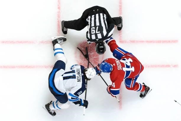 June 7: Nick Suzuki of the Montreal Canadiens faces off against Nate Thompson of the Winnipeg Jets in Game Four of the Second Round of the 2021...