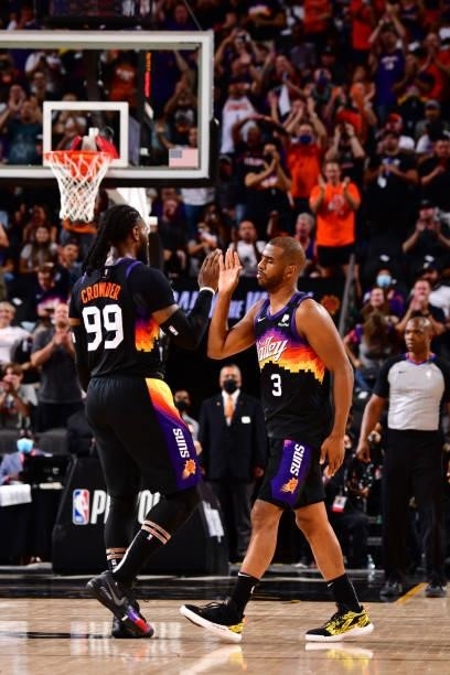Jae Crowder and Chris Paul of the Phoenix Suns high five during Round 2, Game 1 of the 2021 NBA Playoffs on June 7, 2021 at Phoenix Suns Arena in...