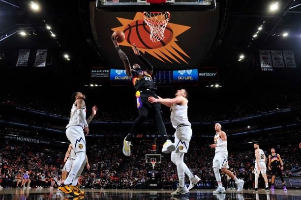 Deandre Ayton of the Phoenix Suns drives to the basket against the Denver Nuggets during Round 2, Game 1 of the 2021 NBA Playoffs on June 7, 2021 at...