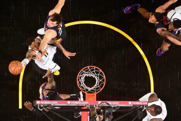 Monte Morris of the Denver Nuggets drives to the basket against the Phoenix Suns during Round 2, Game 1 of the 2021 NBA Playoffs on June 7, 2021 at...