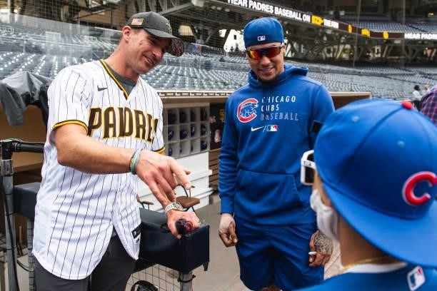 Former Saints quarterback Drew Brees meets with Javier Baez of the Chicago Cubs before facing the San Diego Padres at Petco Park on June 7, 2021 in...