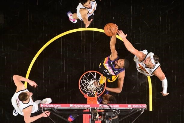 Mikal Bridges of the Phoenix Suns rebounds the ball against the Denver Nuggets during Round 2, Game 1 of the 2021 NBA Playoffs on June 7, 2021 at...