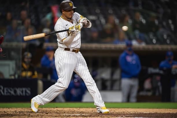Manny Machado of the San Diego Padres hits a home run in the eighth inning against the Chicago Cubs at Petco Park on June 7, 2021 in San Diego,...