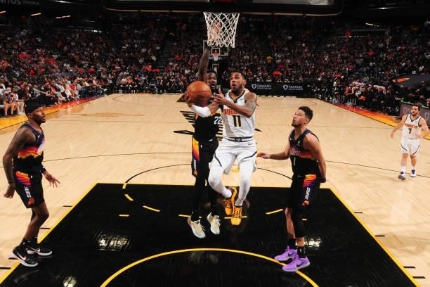Monte Morris of the Denver Nuggets drives to the basket against the Phoenix Suns during Round 2, Game 1 of the 2021 NBA Playoffs on June 7, 2021 at...