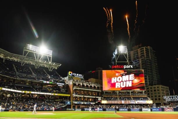 Fireworks go off around the ballpark as Manny Machado of the San Diego Padres jogs around the bases after hitting a home run in the eighth inning...