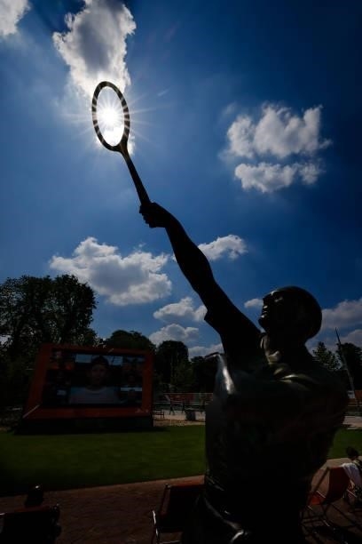 June 2021, France, Paris: Tennis: Grand Slam, French Open. The sun shines on the statue of the French tennis player Jean Borotra on the grounds of...
