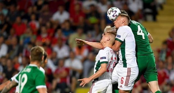 Budapest , Hungary - 8 June 2021; Shane Duffy of Republic of Ireland in action against András Schafer, left, and Willi Orban of Hungary during the...
