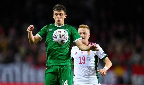 Budapest , Hungary - 8 June 2021; Jason Knight of Republic of Ireland in action against Kevin Varga of Hungary during the international friendly...