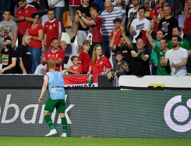 Budapest , Hungary - 8 June 2021; Daryl Horgan of Republic of Ireland throws his jersey to supporters following the international friendly match...