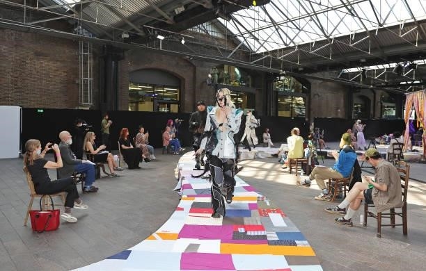 Model walks the runway at the Central Saint Martins BA Fashion Show 2021 in Granary Square on June 8, 2021 in London, England.