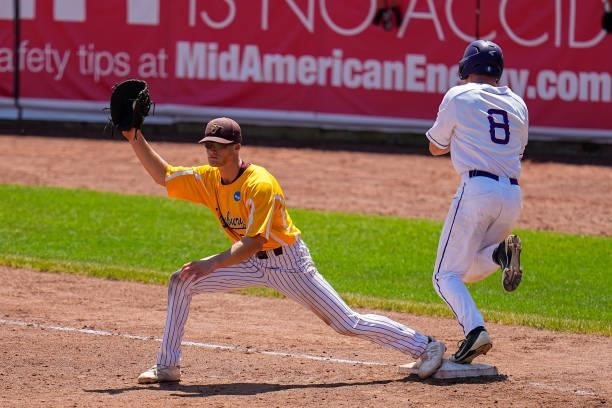 Josh Thorp of St. Thomas is out at first by Sky Rahill of Salisbury during the Division III Men's Baseball Championship held at Perfect Game Field at...