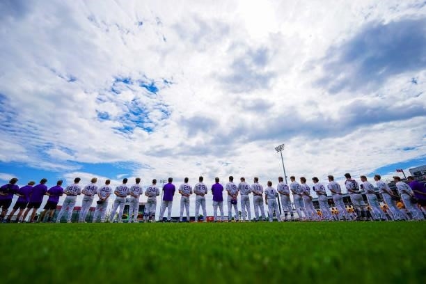 Members of the St. Thomas baseball team line up for the national anthem before the Division III Men's Baseball Championship against Salisbury held at...
