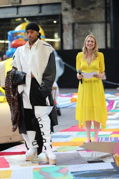 Finalist Dylan Mekhi and Catherine McMahon, Director International Artistic Relations, L'Oreal Professionnel, attend the Central Saint Martins BA...