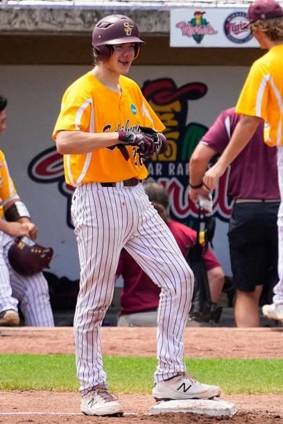 Jacob Ference looks on after being injured on a pitch against St. Thomas during the Division III Men's Baseball Championship held at Perfect Game...