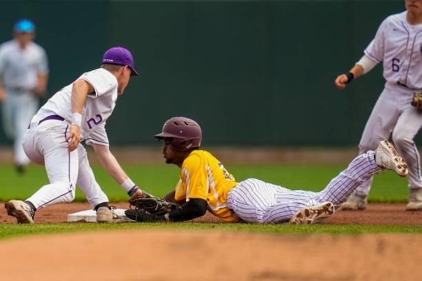 Kavi Caster is tagged out at second base after an attempted steal against Matthew Enck of St Thomas during the Division III Men's Baseball...