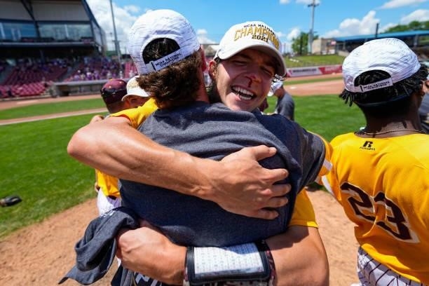 Jacob Ference of Salisbury celebrates a win against St. Thomas with a teammate during the Division III Men's Baseball Championship held at Perfect...