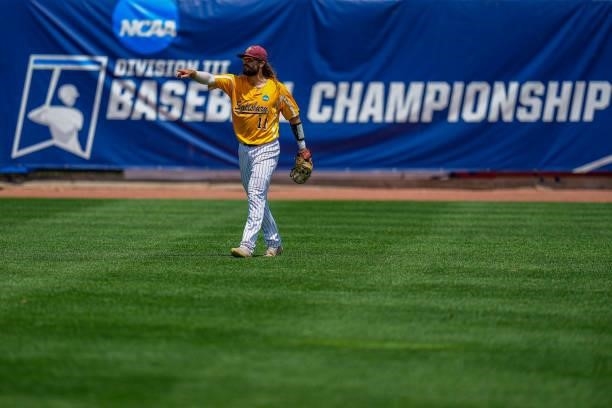 Justin Meekins celebrates an out against St. Thomas during the Division III Men's Baseball Championship held at Perfect Game Field at Veterans...