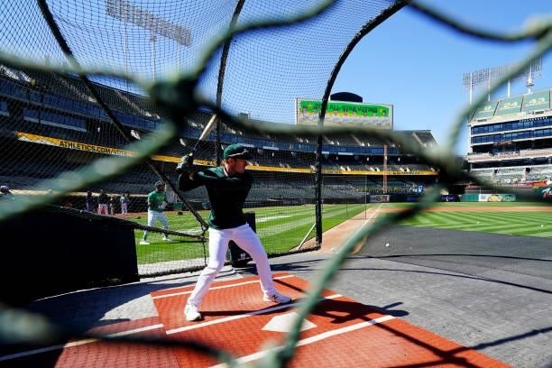 Mark Canha of the Oakland Athletics takes batting practice prior to the game between the Arizona Diamondbacks and the Oakland Athletics at Oakland...