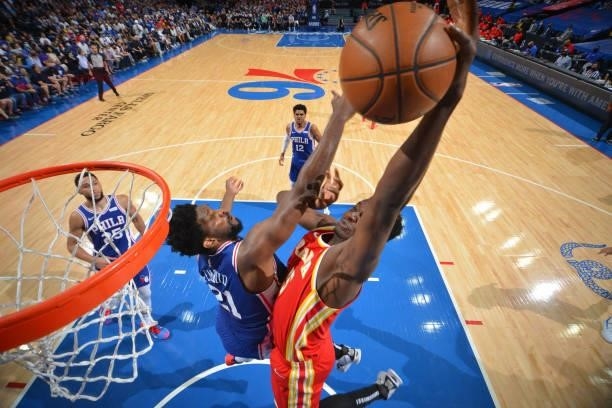 Clint Capela of the Atlanta Hawks dunks the ball against Joel Embiid of the Philadelphia 76ers during Round 2, Game 2 of the Eastern Conference...