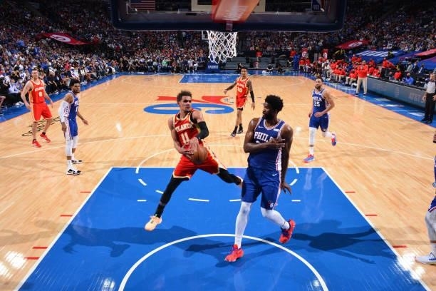 Trae Young of the Atlanta Hawks handles the ball against Joel Embiid of the Philadelphia 76ers during Round 2, Game 2 of the Eastern Conference...