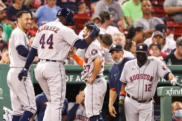 Yordan Alvarez of the Houston Astros reacts with Jose Altuve of the Houston Astros after hitting a solo home run in the fourth inning of a game...