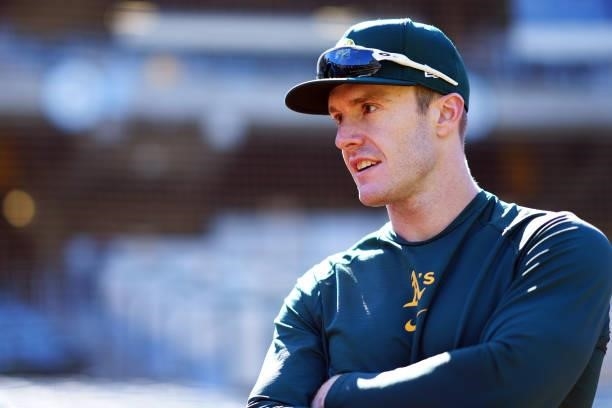 Mark Canha of the Oakland Athletics looks on during batting practice prior to the game between the Arizona Diamondbacks and the Oakland Athletics at...