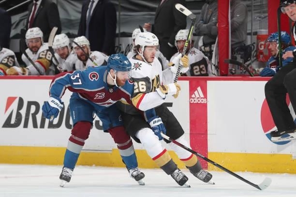 Mattias Janmark of the Vegas Golden Knights fights for position against J.T. Compher of the Colorado Avalanche in Game Five of the Second Round of...