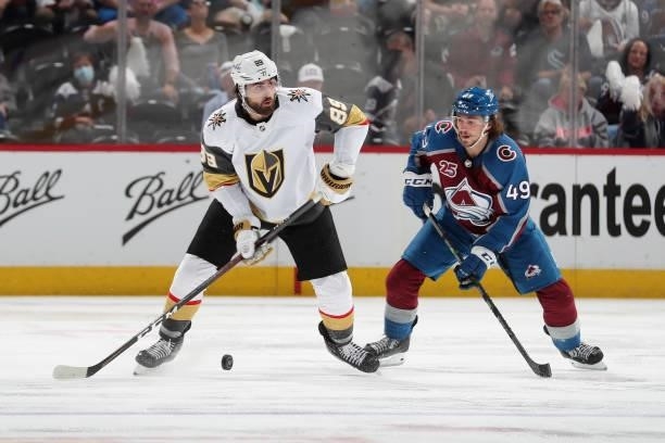 Alex Tuch of the Vegas Golden Knights handles the puck against Samuel Girard of the Colorado Avalanche in Game Five of the Second Round of the 2021...