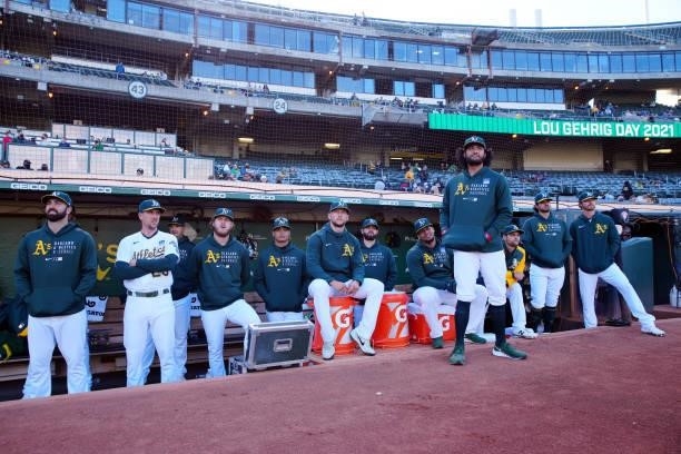 Members of the Oakland Athletics look on during the pre-game ceremony on Lou Gehrig Day prior to the game between the Arizona Diamondbacks and the...