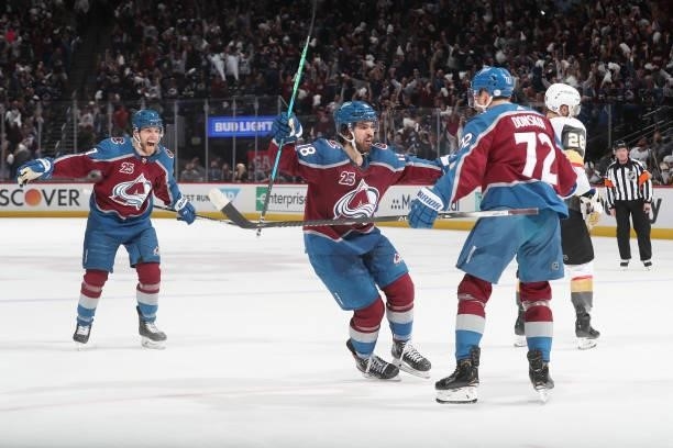 Joonas Donskoi of the Colorado Avalanche celebrates with teammates Alex Newhook and Brandon Saad after scoring a goal against the Vegas Golden...