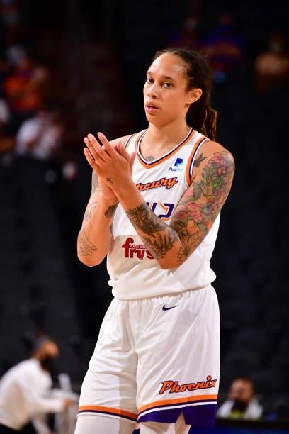 Brittney Griner of the Phoenix Mercury cheers on teammates during the game against the Dallas Wings on June 8, 2021 at Phoenix Suns Arena in Phoenix,...