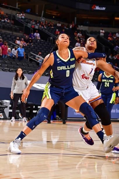 Satou Sabally of the Dallas Wings and Kia Vaughn of the Phoenix Mercury fight for rebound during the game on June 8, 2021 at Phoenix Suns Arena in...