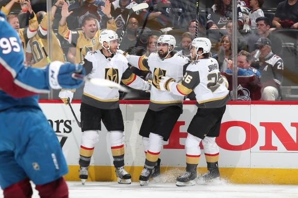 Alex Tuch of the Vegas Golden Knights celebrates a goal against the Colorado Avalanche with teammates Mattias Janmark and Brayden McNabb in Game Five...