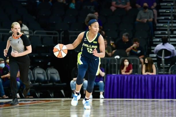 Tyasha Harris of the Dallas Wings handles the ball against the Phoenix Mercury on June 8, 2021 at Phoenix Suns Arena in Phoenix, Arizona. NOTE TO...