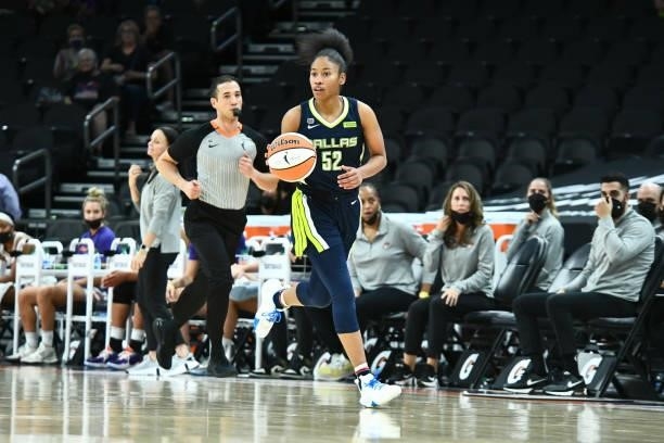 Tyasha Harris of the Dallas Wings handles the ball against the Phoenix Mercury on June 8, 2021 at Phoenix Suns Arena in Phoenix, Arizona. NOTE TO...