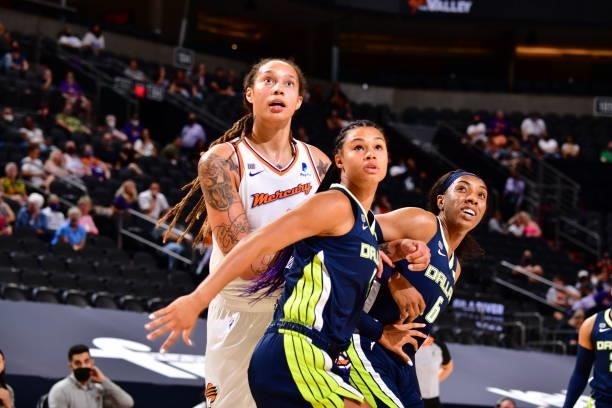 Satou Sabally of the Dallas Wings fights Brittney Griner of the Phoenix Mercury for rebound during the game on June 8, 2021 at Phoenix Suns Arena in...