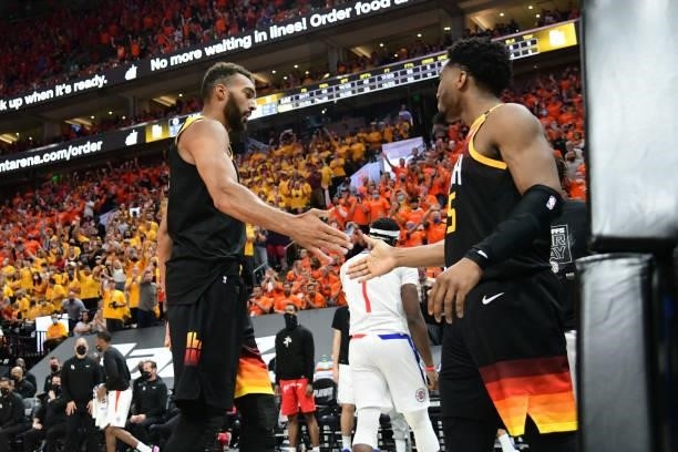 Rudy Gobert hi-fives Donovan Mitchell of the Utah Jazz during Round 2, Game 1 of the 2021 NBA Playoffs on June 8, 2021 at vivint.SmartHome Arena in...