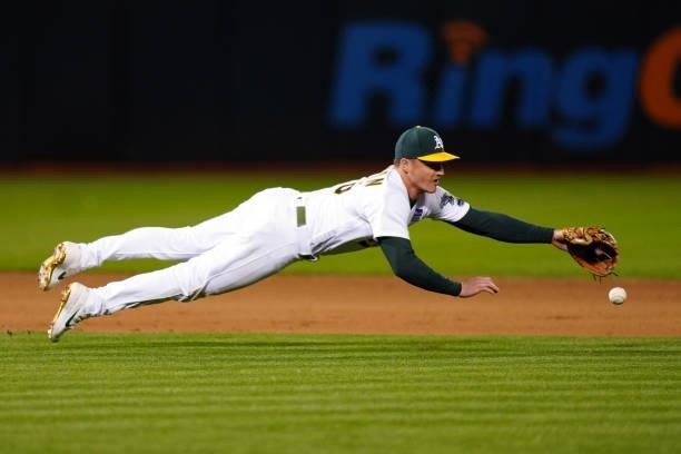 Matt Chapman of the Oakland Athletics dives for a ball during the game between the Arizona Diamondbacks and the Oakland Athletics at Oakland Coliseum...