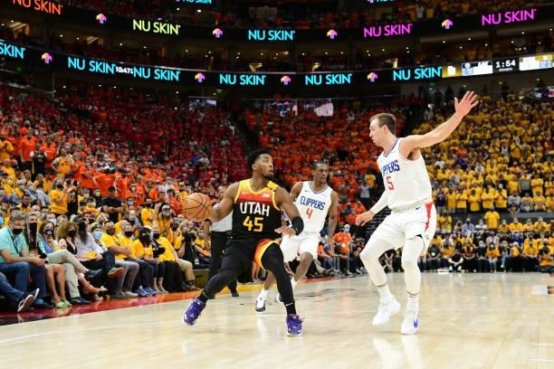 Luke Kennard of the LA Clippers plays defense on Donovan Mitchell of the Utah Jazz during Round 2, Game 1 of the 2021 NBA Playoffs on June 8, 2021 at...