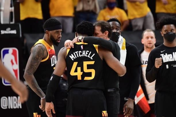 Head Coach Quin Snyder of the Utah Jazz hugs Donovan Mitchell during Round 2, Game 1 of the 2021 NBA Playoffs on June 8, 2021 at vivint.SmartHome...
