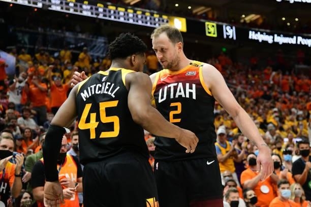 Donovan Mitchell hi-fives Joe Ingles of the Utah Jazz during Round 2, Game 1 of the 2021 NBA Playoffs on June 8, 2021 at vivint.SmartHome Arena in...