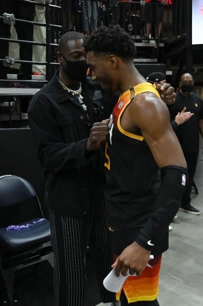 Minority Owner, Dwyane Wade of the Utah Jazz talks with Donovan Mitchell during Round 2, Game 1 of the 2021 NBA Playoffs on June 8, 2021 at...