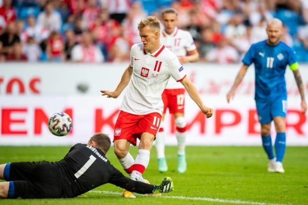 Karol Swiderski of Poland and Ogmundur Kristinsson of Iceland battle for the ball during the international friendly match between Poland and Iceland...
